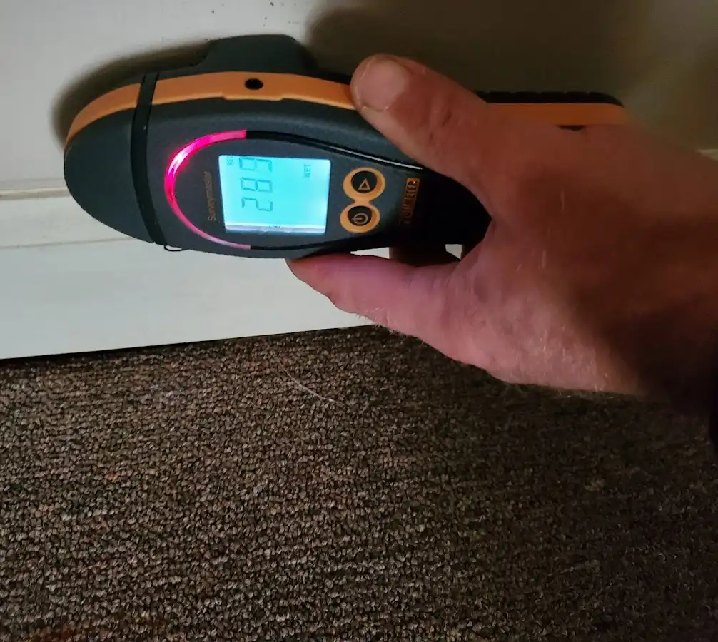 Moisture detection at baseboard during Storm Damage Restoration in Lugoff